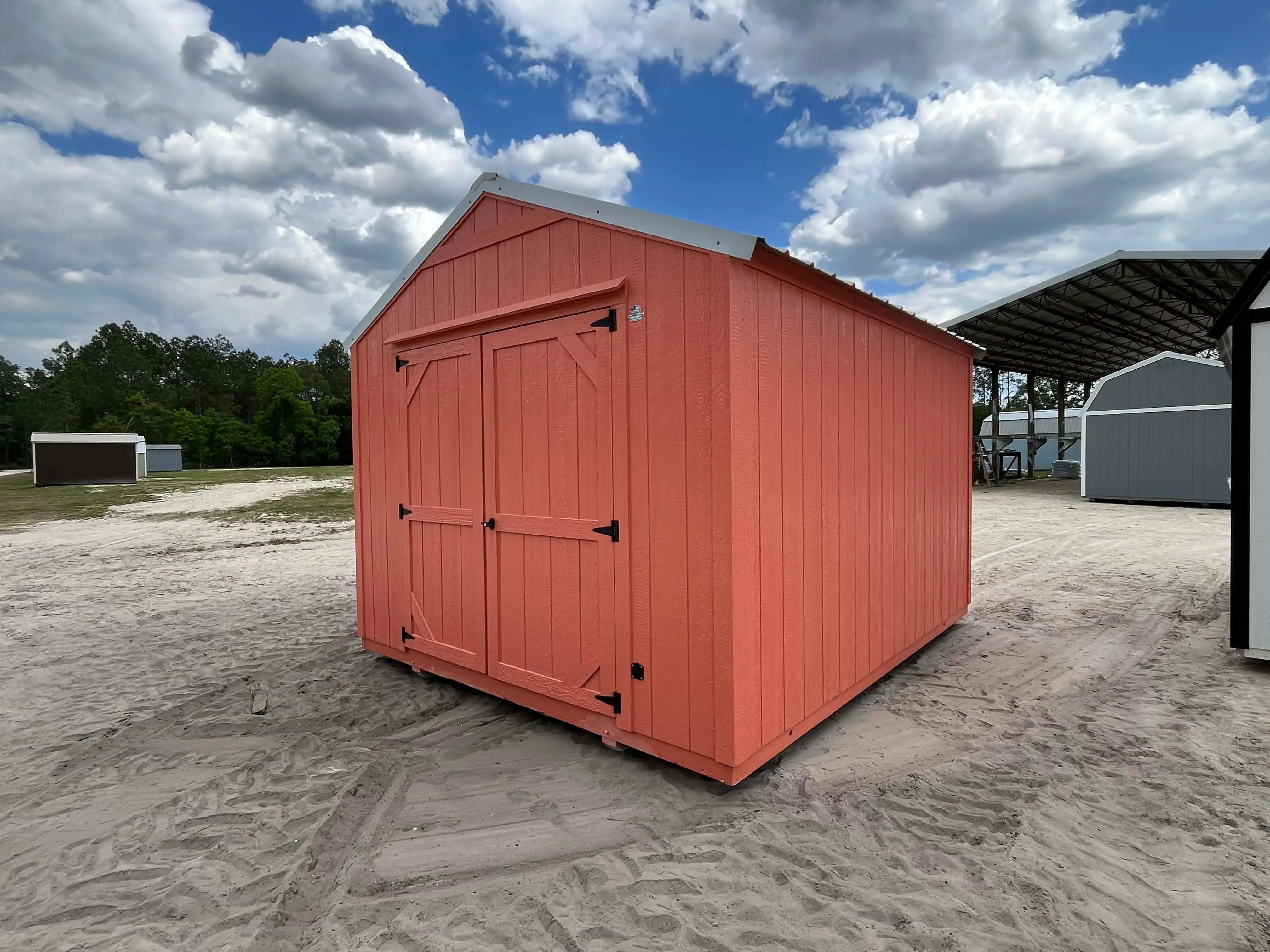 Exterior right front view of a 10x12 garden shed economy showing the double wood doors