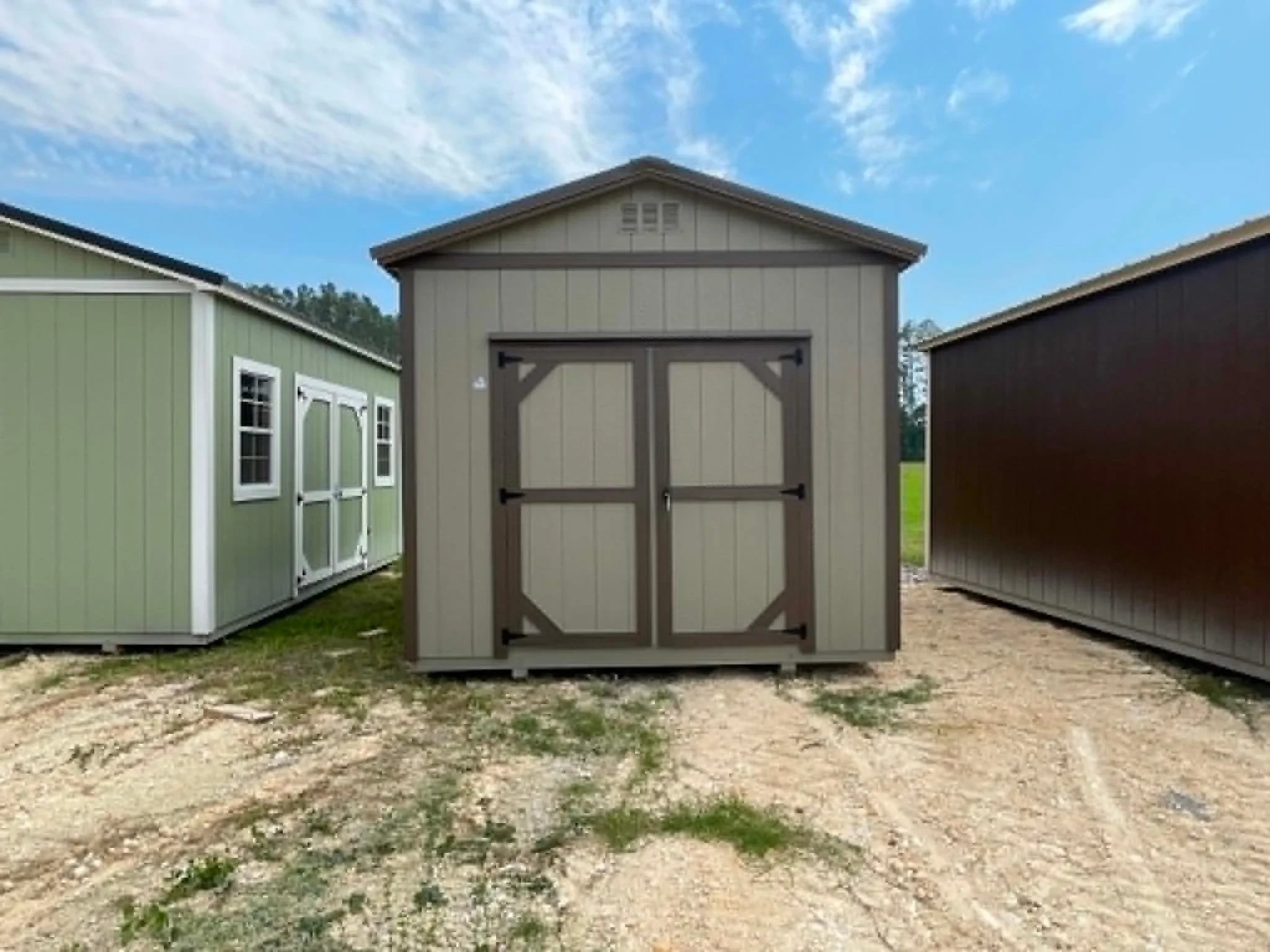 Exterior front view of a 10x12 garden shed with double wood doors