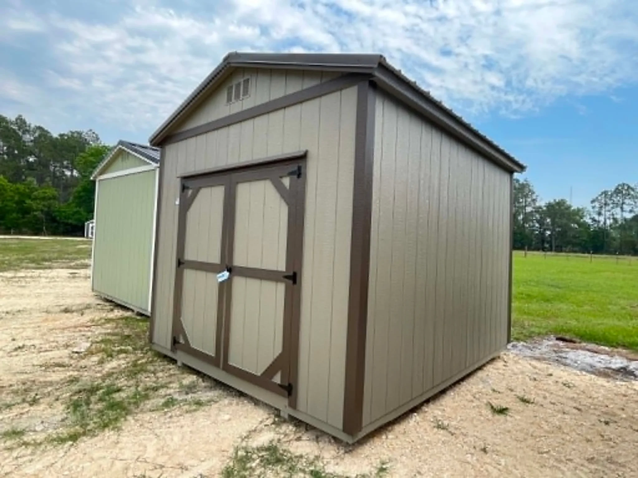 Exterior front right view of a 10x12 garden shed with double wood doors