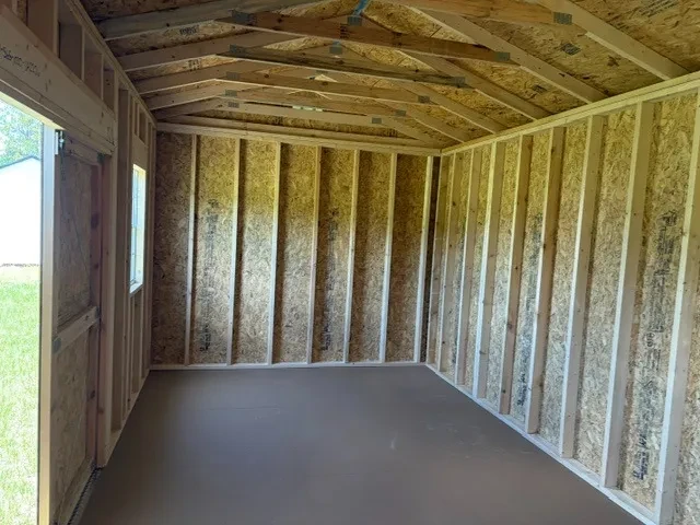 Interior of a 10x20 side garden shed showing doors and window