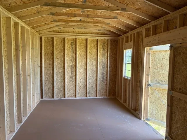 Interior of a 10x20 side garden shed showing doors and window