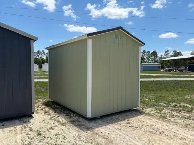 Exterior rear of a sage green 8x12 Garden shed