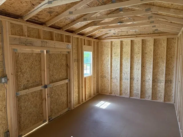 Interior view of a 10x20 side garden shed showing the window, doors and electric