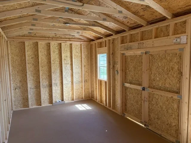 Interior view of a 10x20 side garden shed showing the window, doors and electric