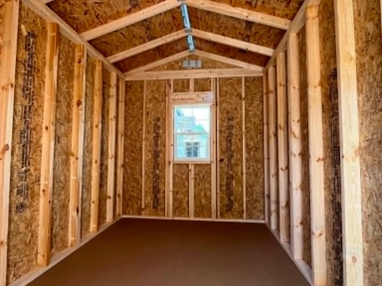 Interior view of an 8x12 garden shed showing the window