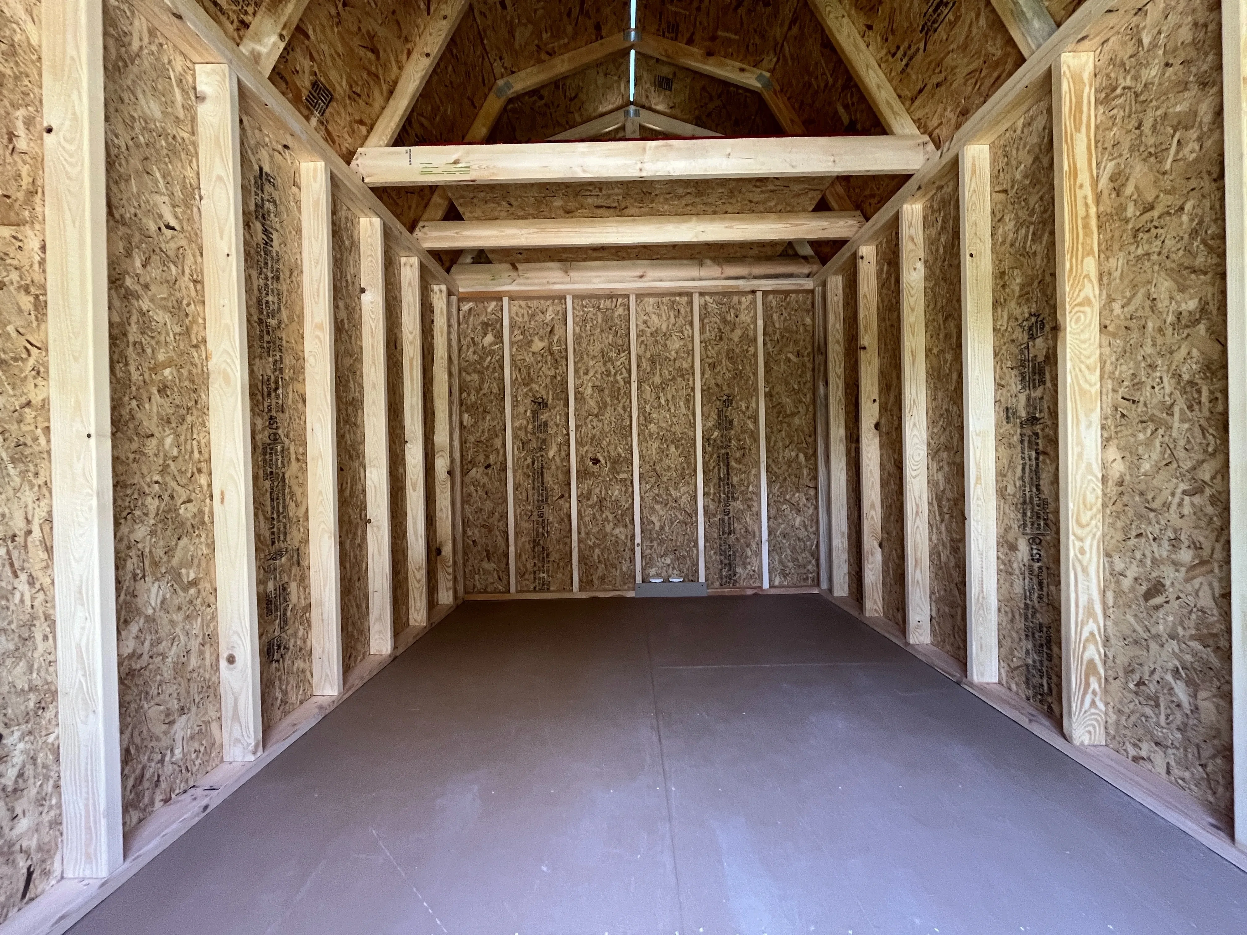 Interior view of an 8x12 lofted barn showing the loft