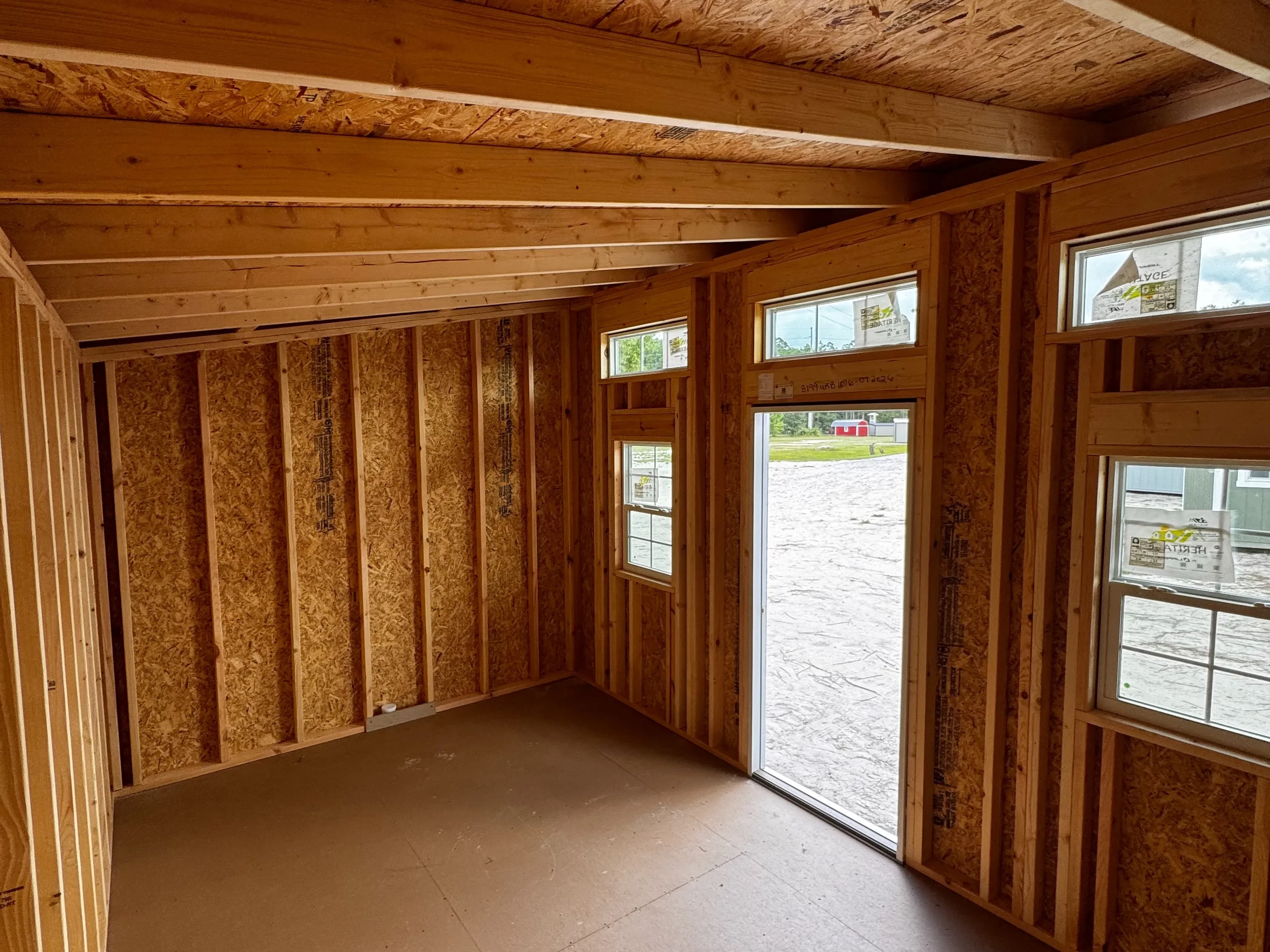 interior view of a 10x16 urban showing the walk-in door and windows