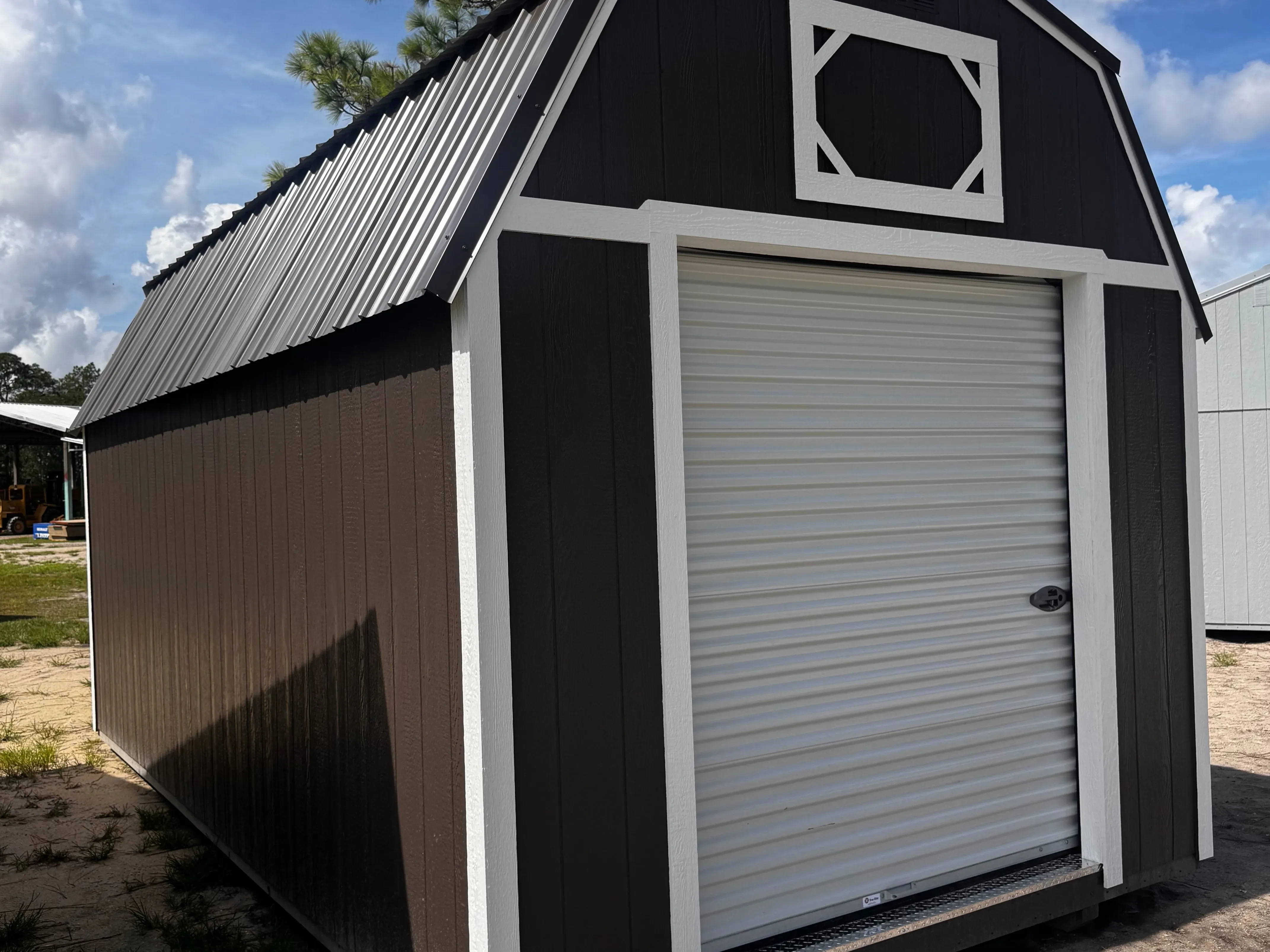 Exterior of a Bronze 10x20 Lofted Workshop showing a garage door in the end