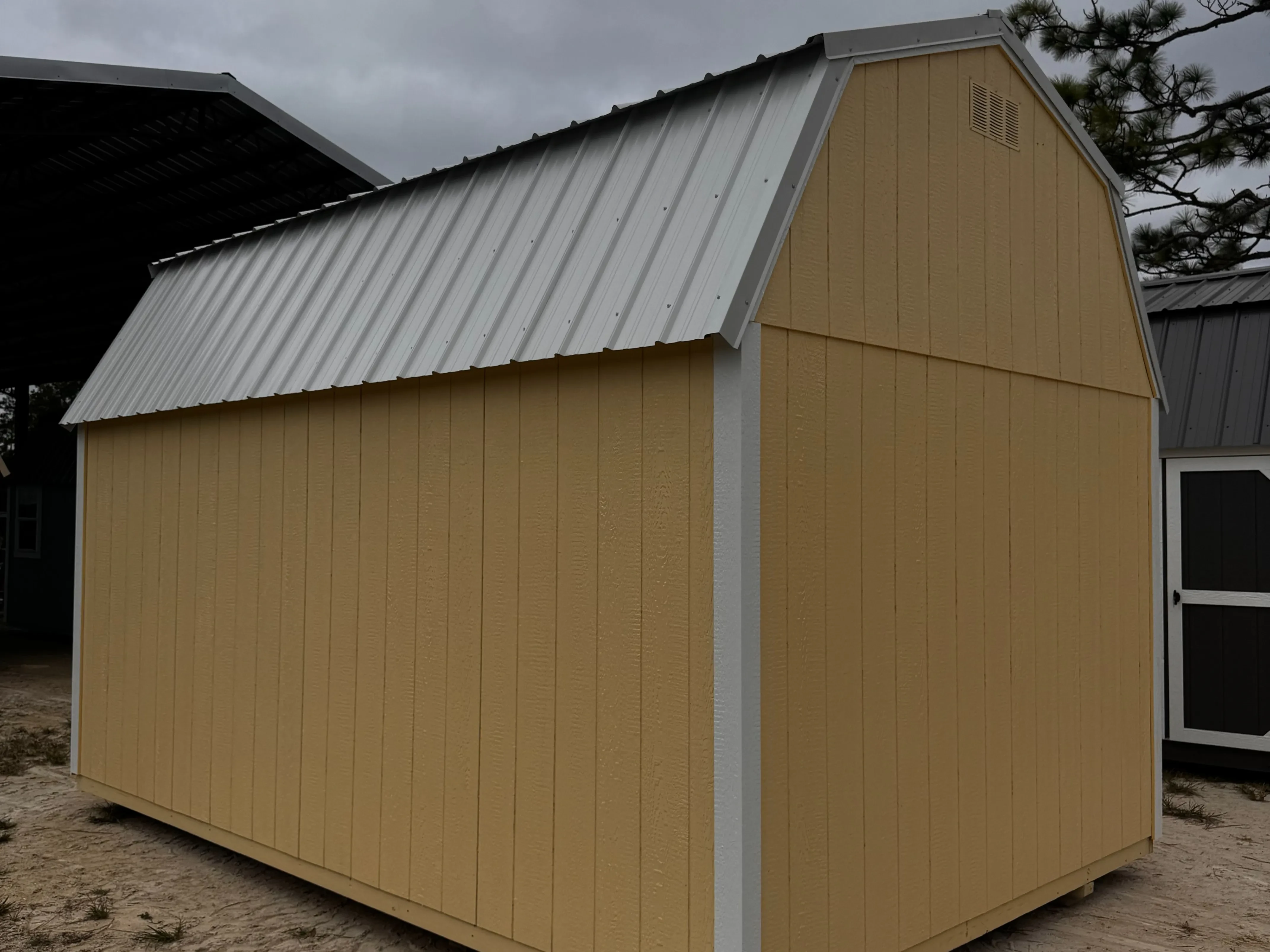 1Exterior back view of a Banana Cream 10x16 lofted barn