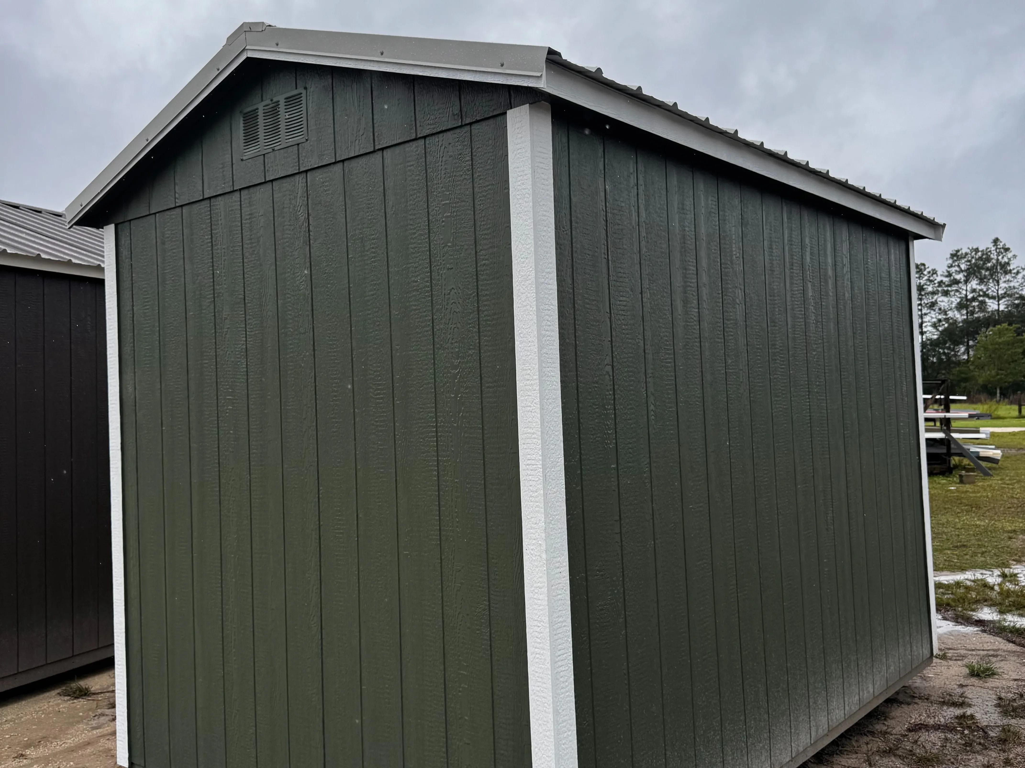 Exterior rear view of a garland green side garden shed
