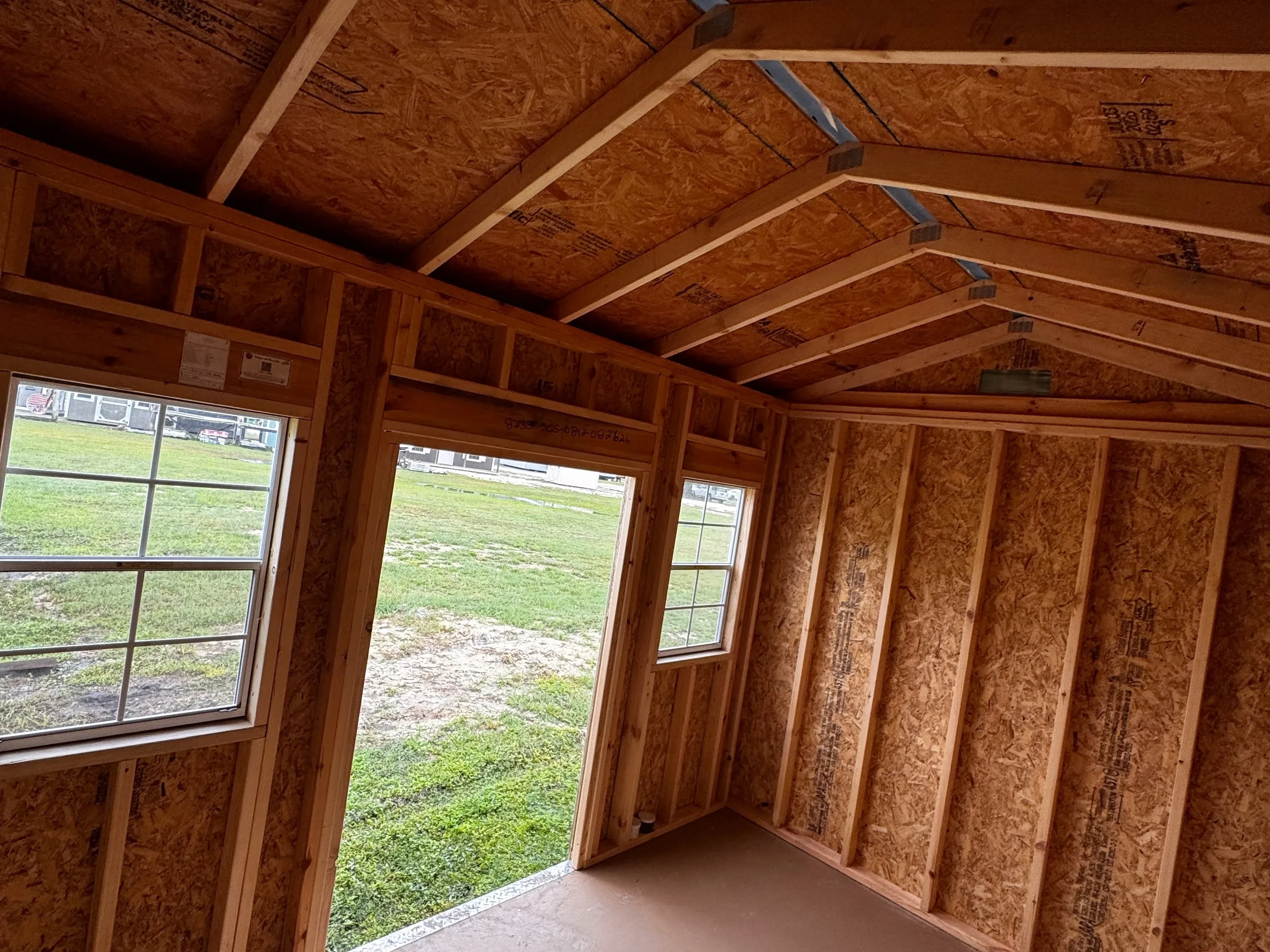 interior view of an 08x12 side garden shed showing the door and windows